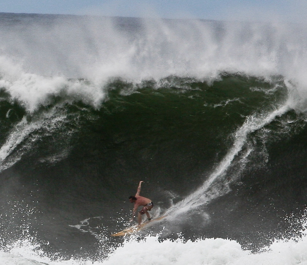 Riding a 20 foot wave at Oahu's North Shore Riding a 20 foot wave at Oahu's North Shore